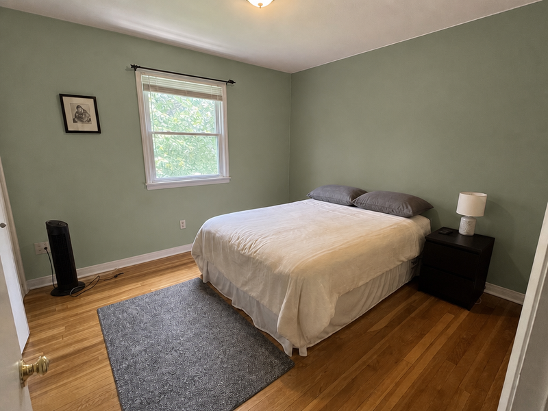 A bedroom wall with two colour options shown side-by-side.